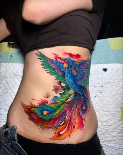 Tatuaje de ave fenix en el abdomen realizado por Hendric Shinigami tatuaje realizado por Hendric Shinigami