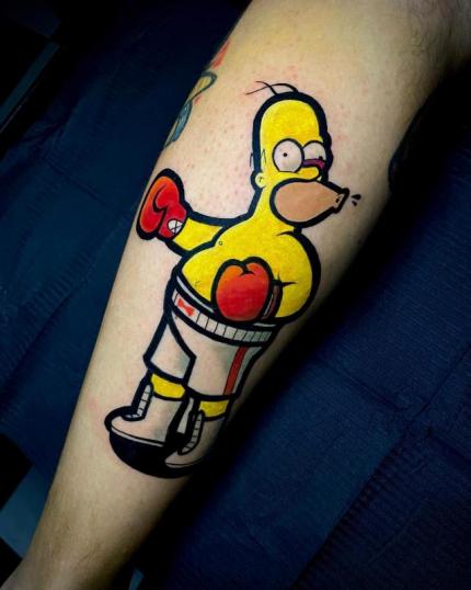 Tatuaje de Homero boxeador en los Simpson realizado por Sacres RMBS tatuaje realizado por Sacres RMBS