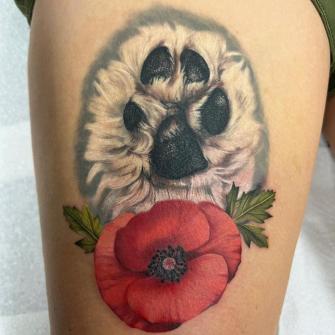 Tatuaje de pata de perro realista realizado por Dagmara Cielecka tatuaje realizado por Dagmara Cielecka