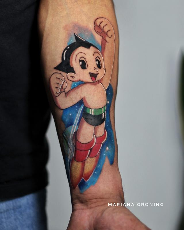 Tatuaje de Astro Boy en el antebrazo realizado por Mariana Groning tatuaje realizado por Mariana Groning